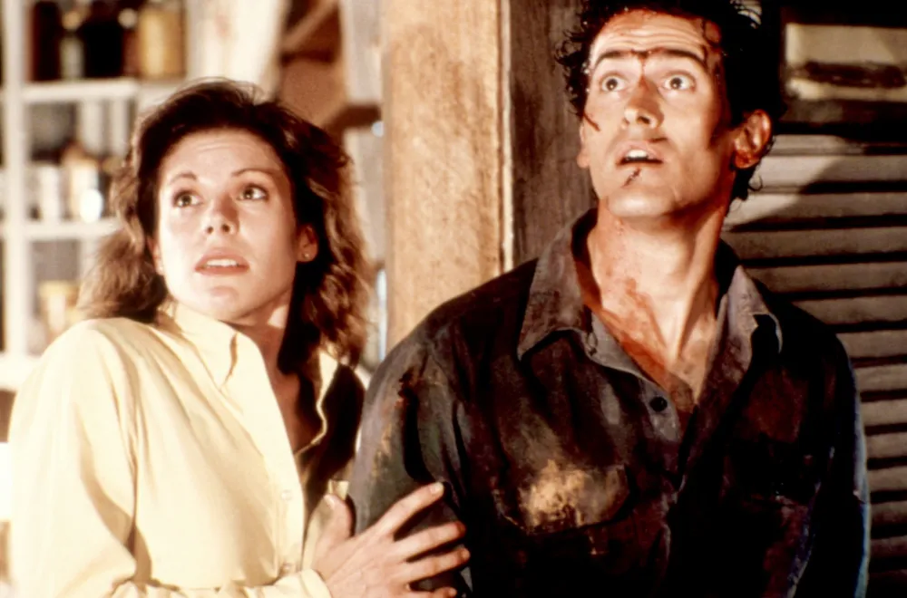Sarah Berry and Bruce Campbell in Evil Dead II
