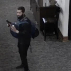 A man with a gun is seen in a Texas synagogue during a hostage situation