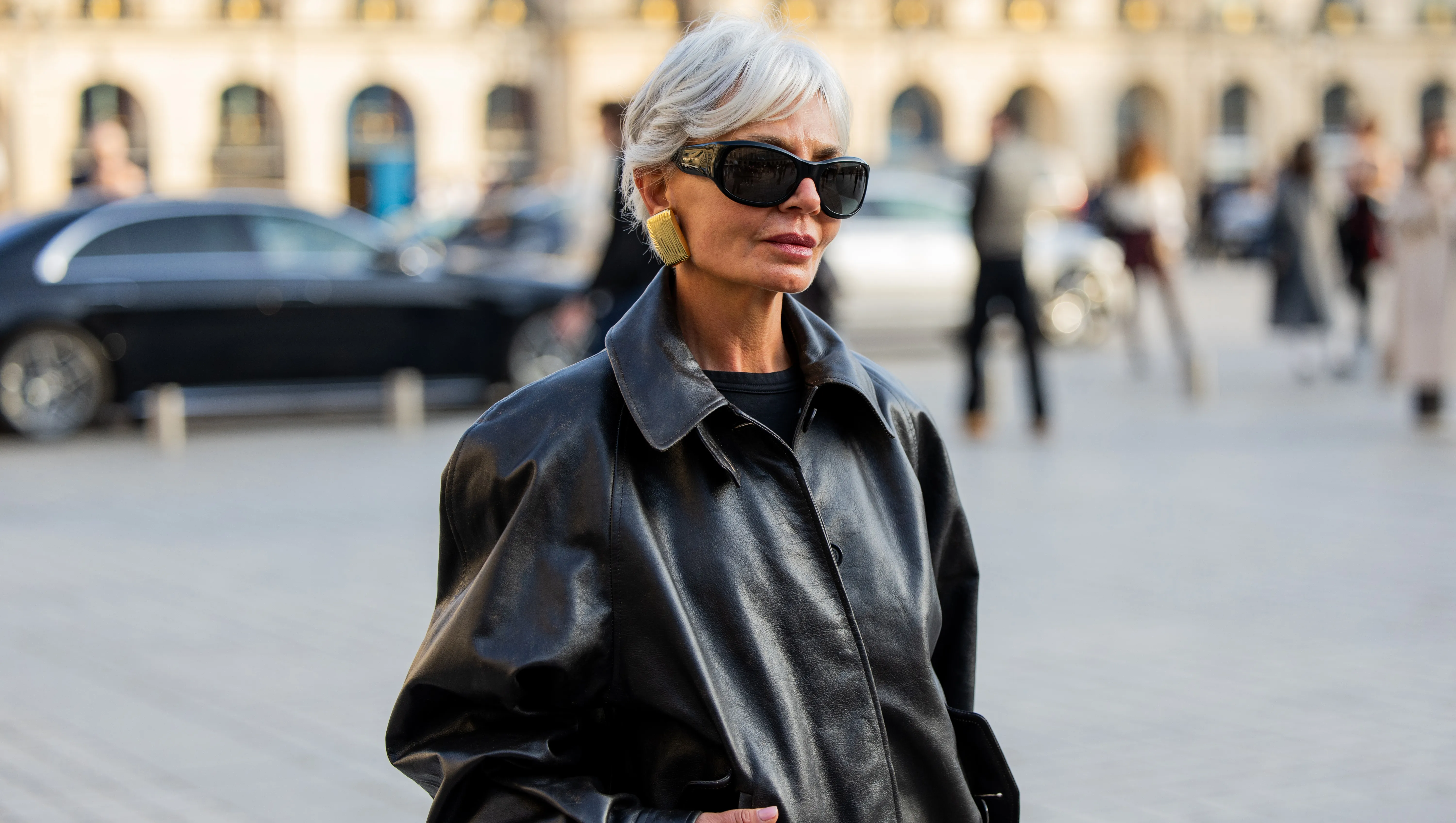 PARIS, FRANCE - MARCH 08: Grece Ghanem wears black leather jacket, skirt with slit, bag, sunglasses outside Magda Butrym during Day Seven of Paris Fashion Week - Womenswear Fall/Winter 2026/2027 on March 08, 2026 in Paris, France. (Photo by Christian Vierig/Getty Images)