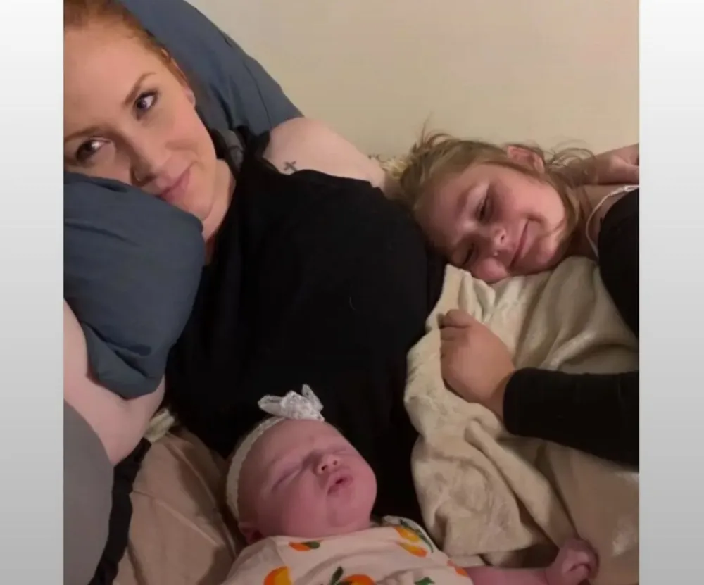 A photo of the mother and her two daughters