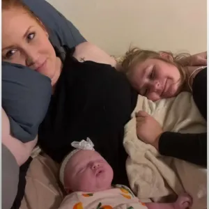 A photo of the mother and her two daughters