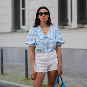 BERLIN, GERMANY - JUNE 14: Alyssa Cordes is seen wearing white shorts Levis, blue checkered top Envii, Adidas sneaker, Prada bag in blue, sunglasses Mango on June 14, 2021 in Berlin, Germany. (Photo by Christian Vierig/Getty Images)