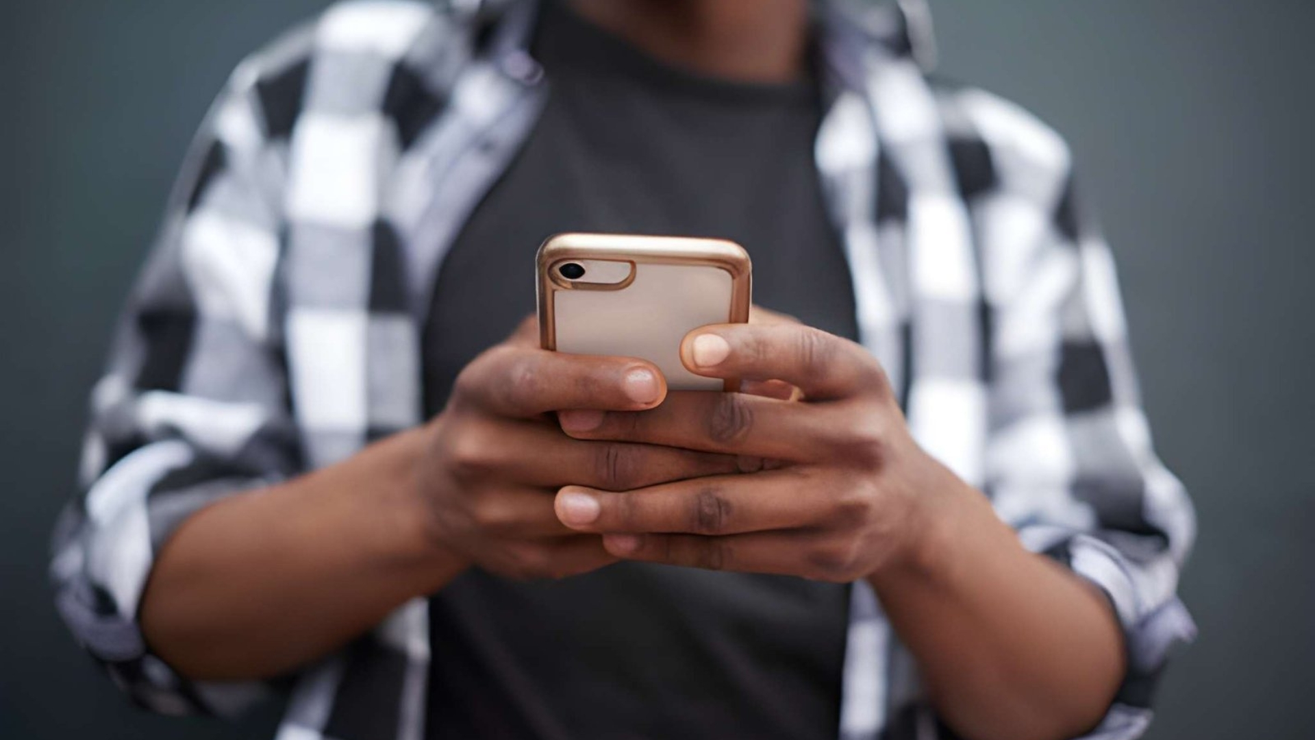 Person using an AirTalk Wireless smartphone for daily tasks