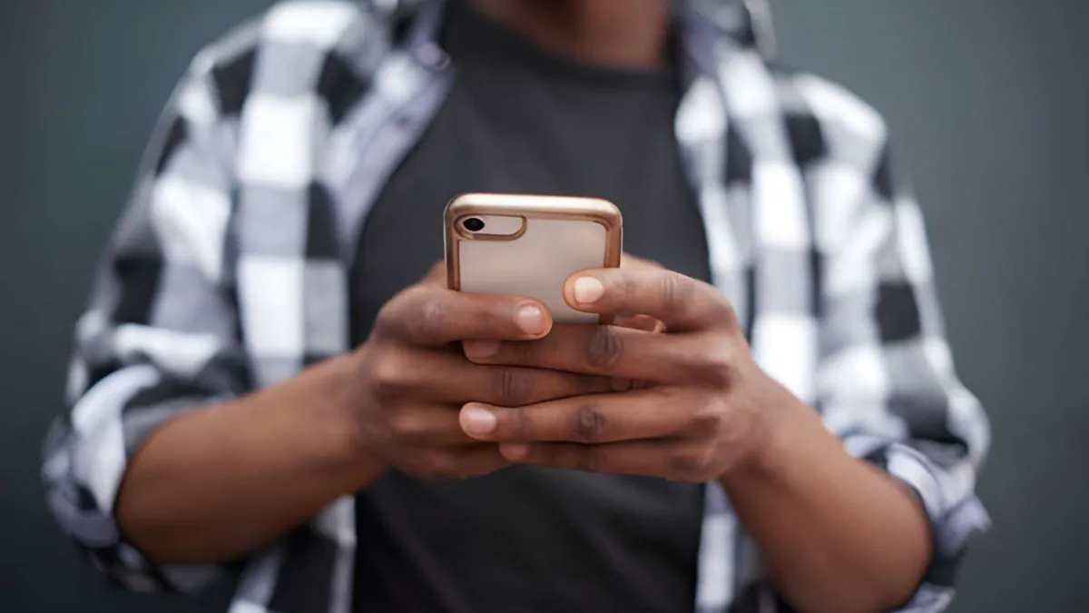 Person using an AirTalk Wireless smartphone for daily tasks