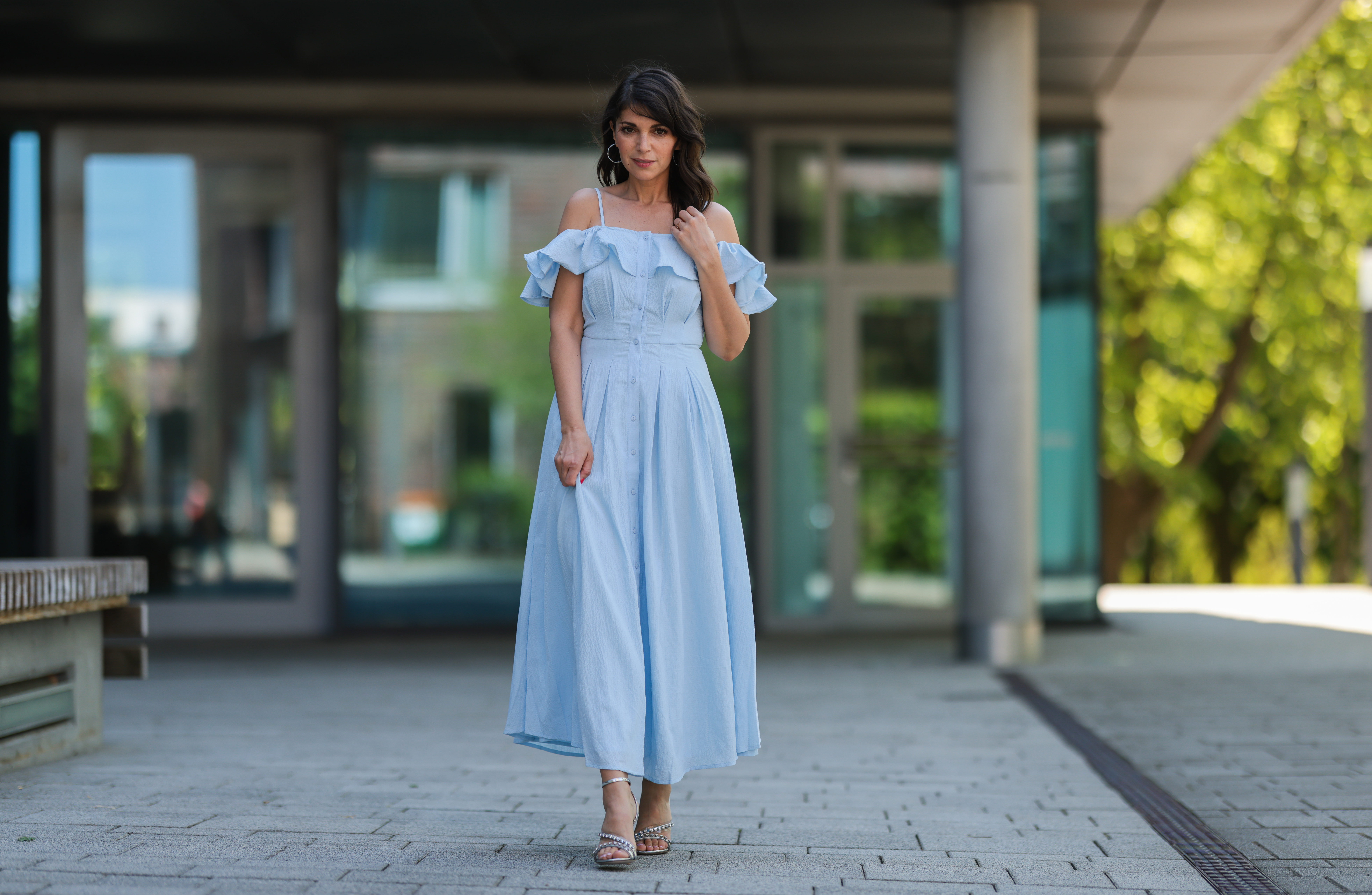 Anna Wolfers wearing light blue flowy dress via Goldig Shop and blue heels on May 31, 2021 in Hamburg, Germany.