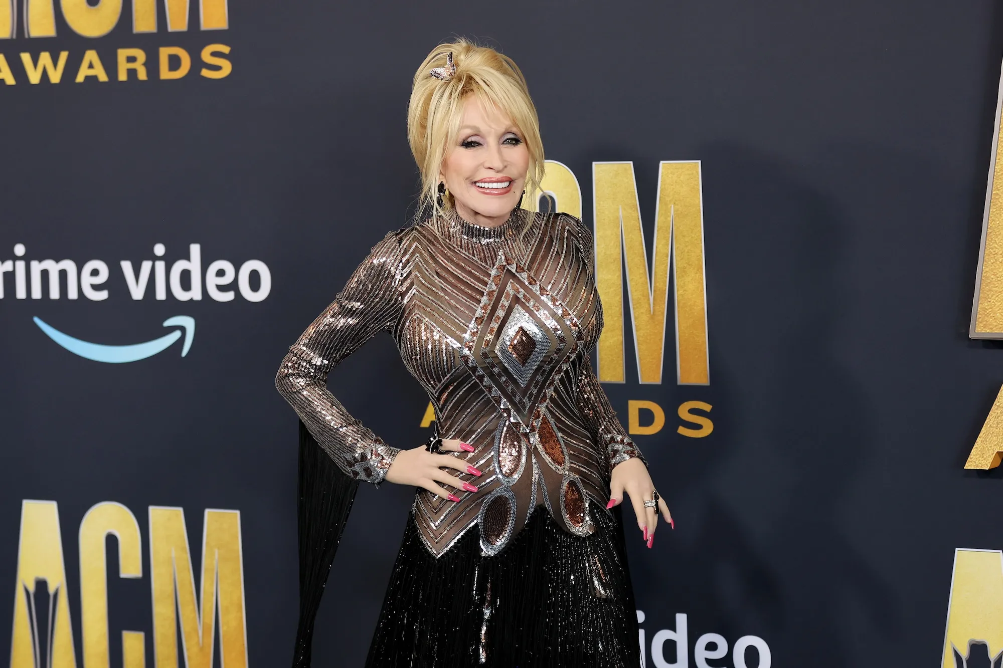GettyImages-1382632890 Dolly Parton Has Secret Tattoos Quotes About Her Ink
