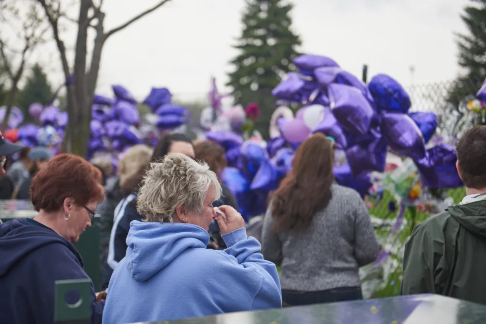 Prince fans crying outside Paisley Park after his death.