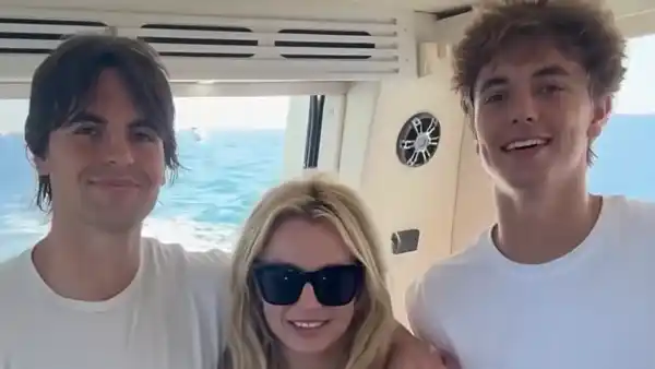 Sean Preston, Britney Spears and Jayden James smiling together on a boat.