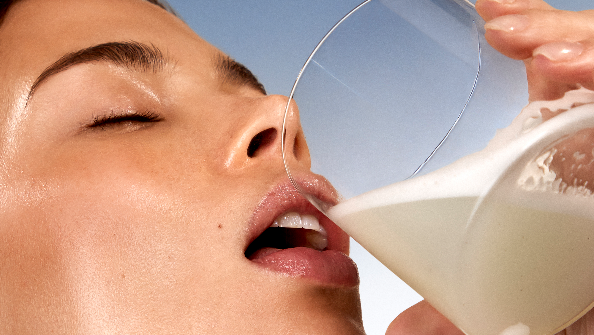 Girl drinking ARMRA Colostrum