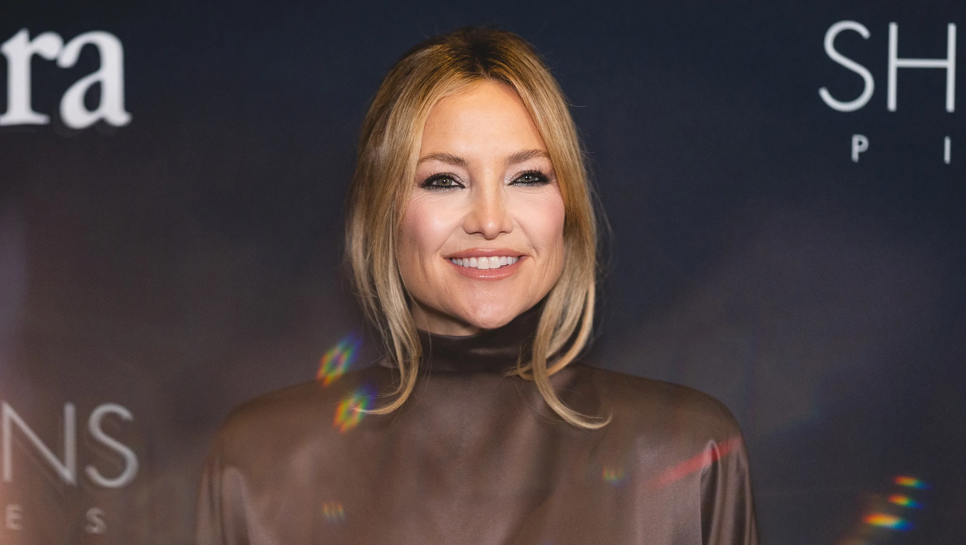 WEST HOLLYWOOD, CALIFORNIA - MARCH 13: (EDITORS NOTE: Image was created in camera using reflective surface) Kate Hudson attends the Women In Film Oscars nominees cocktail party at Wheelhouse on March 13, 2026 in West Hollywood, California. (Photo by Matt Winkelmeyer/WireImage)