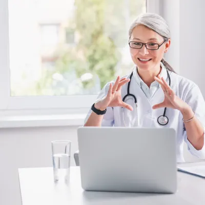 Telemedicine.,Middle,Age,Female,Doctor,Making,Video,Call,Or,Live