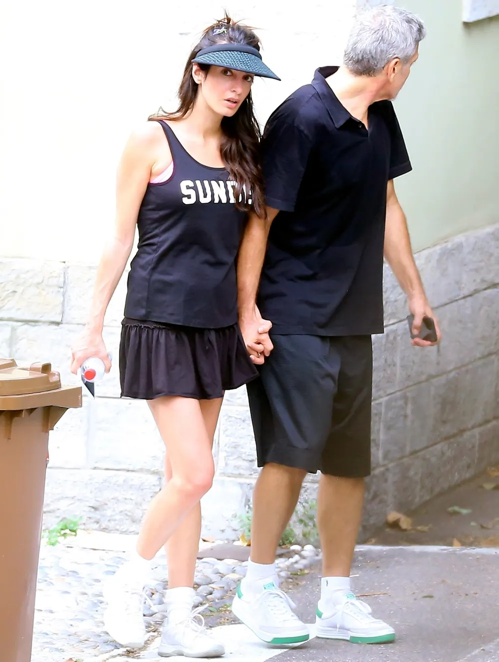 George Clooney and his wife Amal Clooney are spotted looking sporty while heading home after enjoying a tennis match together in Laglio, Italy.