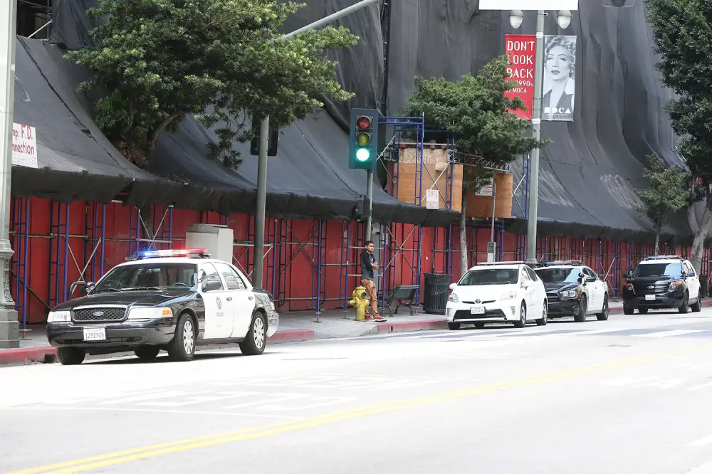 Police outside Amber Heard's downtown Los Angeles apartment amid claims Johnny Depp's people are removing items.
