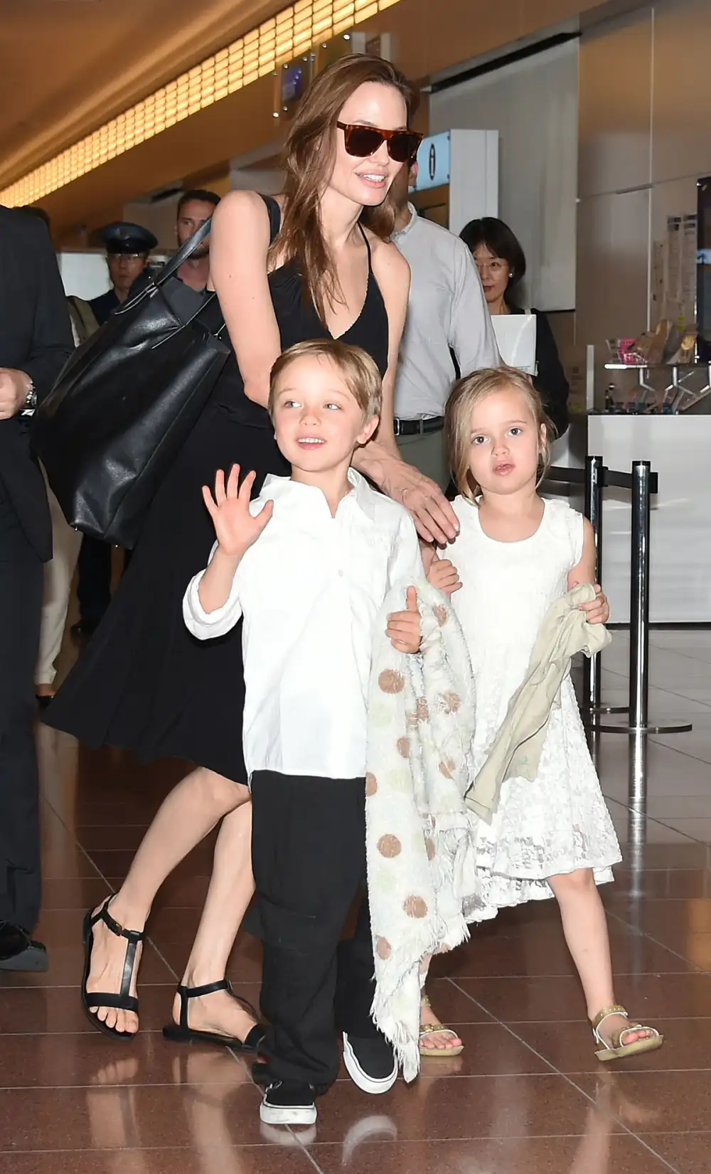 Knox Jolie-Pitt, Angelina Jolie and Vivienne Jolie-Pitt are seen upon arrival at Haneda Airport on June 21, 2014 in Tokyo, Japan