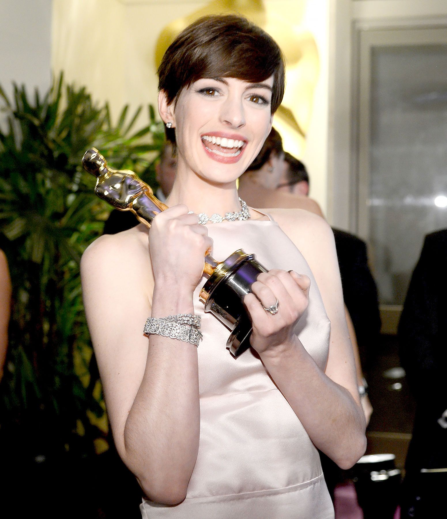 Anne Hathaway holds her trophy for Best Supporting Actress for her performance in 'Les Miserables ' as she attends the Oscars Governors Ball at Hollywood & Highland Center on February 24, 2013 in Hollywood, California.
