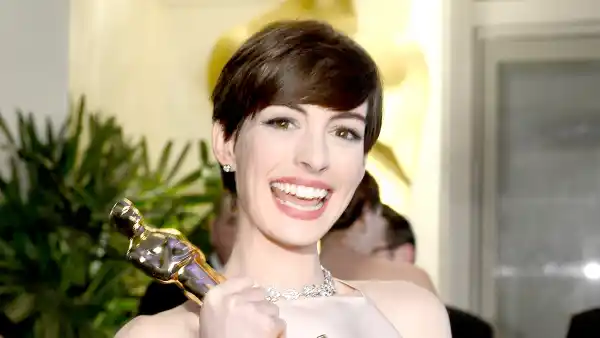 Anne Hathaway holds her trophy for Best Supporting Actress for her performance in 'Les Miserables ' as she attends the Oscars Governors Ball at Hollywood & Highland Center on February 24, 2013 in Hollywood, California.