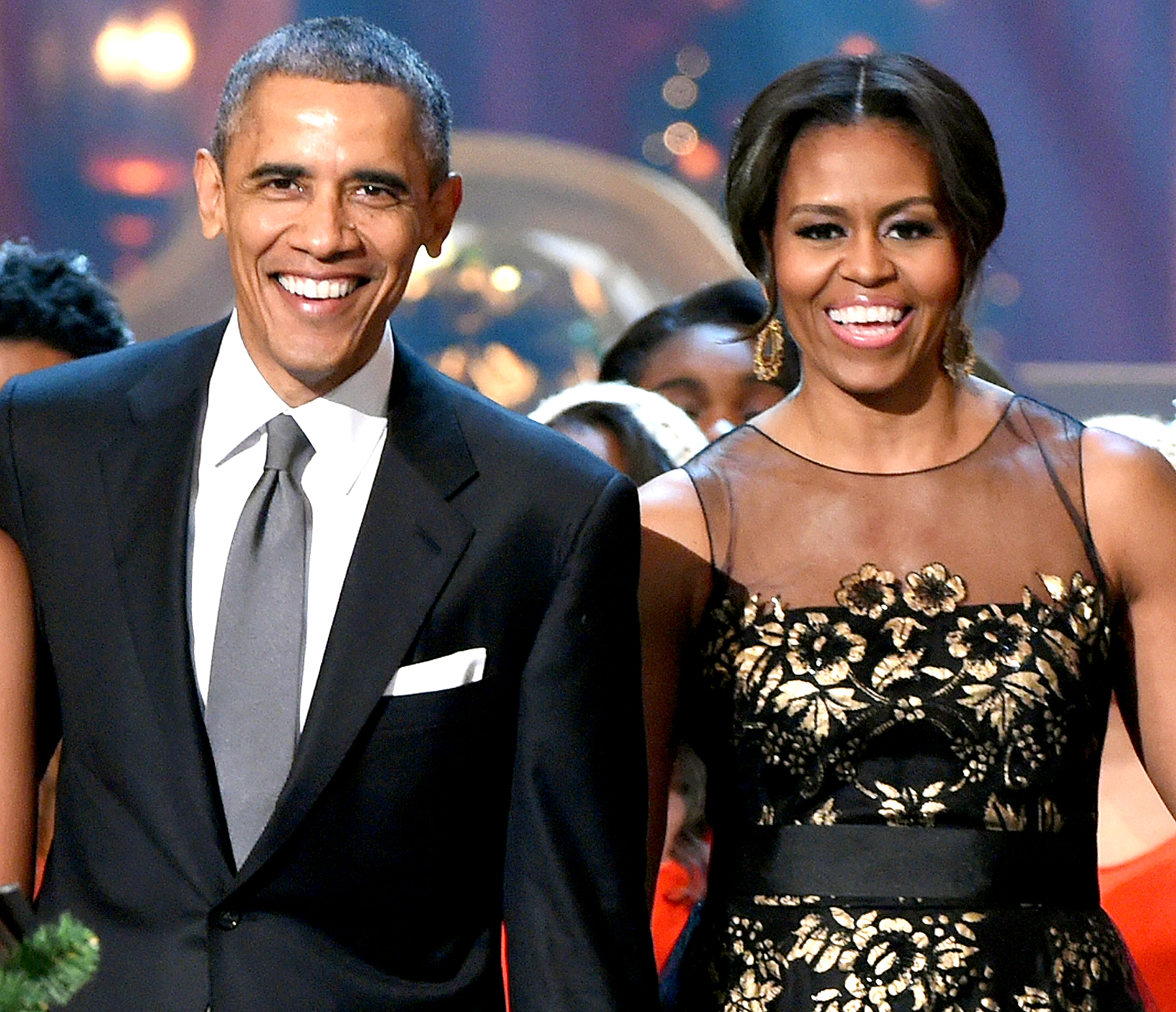 Barack Obama and Michelle Obama speak onstage at TNT Christmas in Washington 2014 at the National Building Museum on December 14, 2014 in Washington, DC.