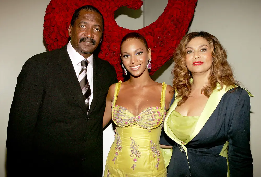 Beyonce Knowles poses with her father, Matthew Knowles, and her mother, Tina Knowles, June 2005 in NYC.