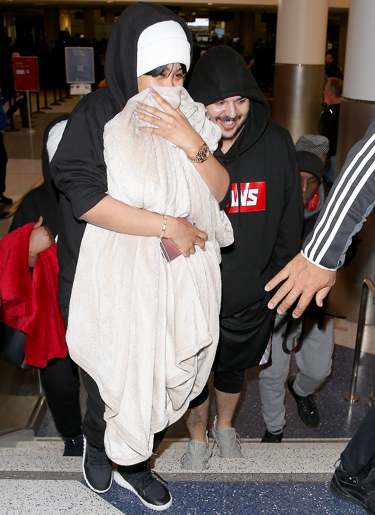 Blac Chyna and Rob Kardashian arrive together at LAX.