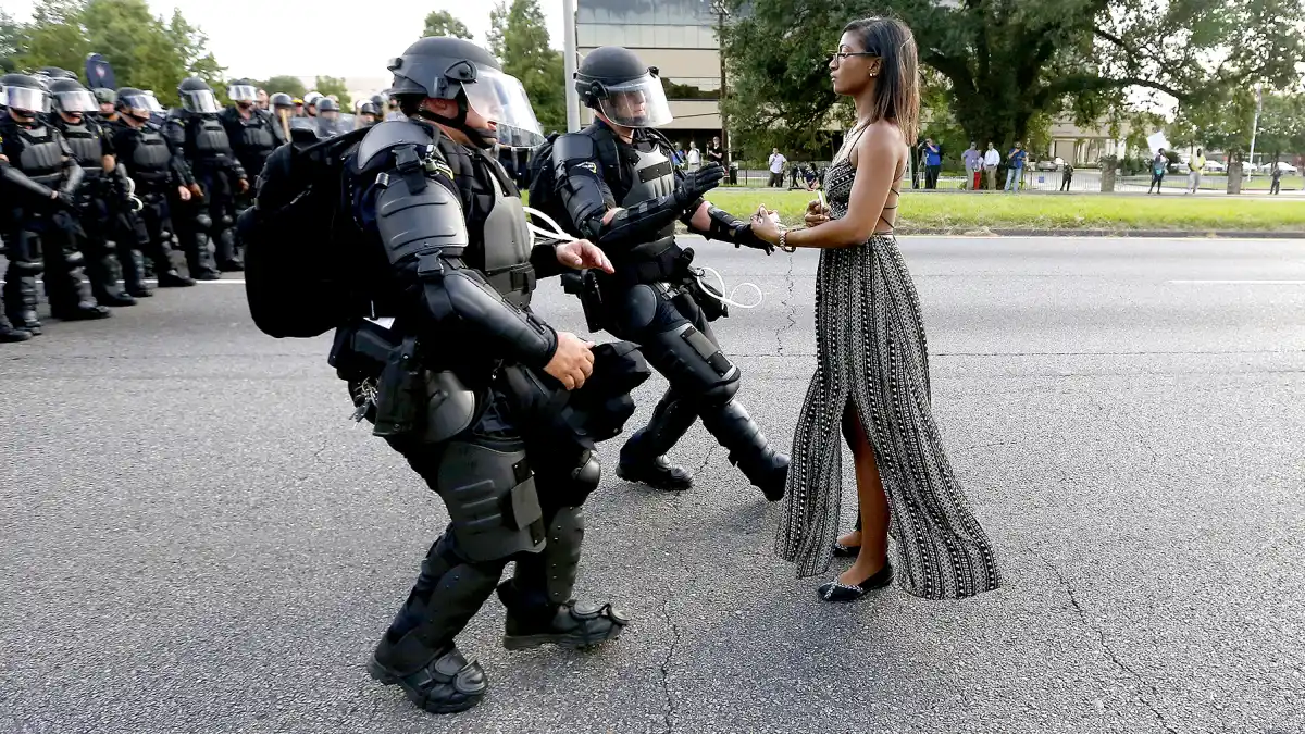 A demonstrator protesting the shooting death of Alton Sterling is detained by law enforcement near the headquarters of the Baton Rouge Police Department in Baton Rouge, Louisiana, U.S. July 9, 2016.