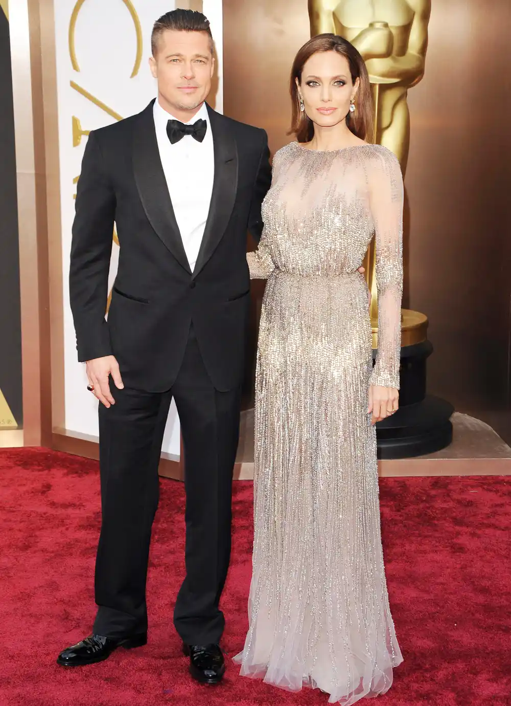 Brad Pitt and Angelina Jolie arrive at the 86th Annual Academy Awards at Hollywood & Highland Center on March 2, 2014 in Hollywood, California.