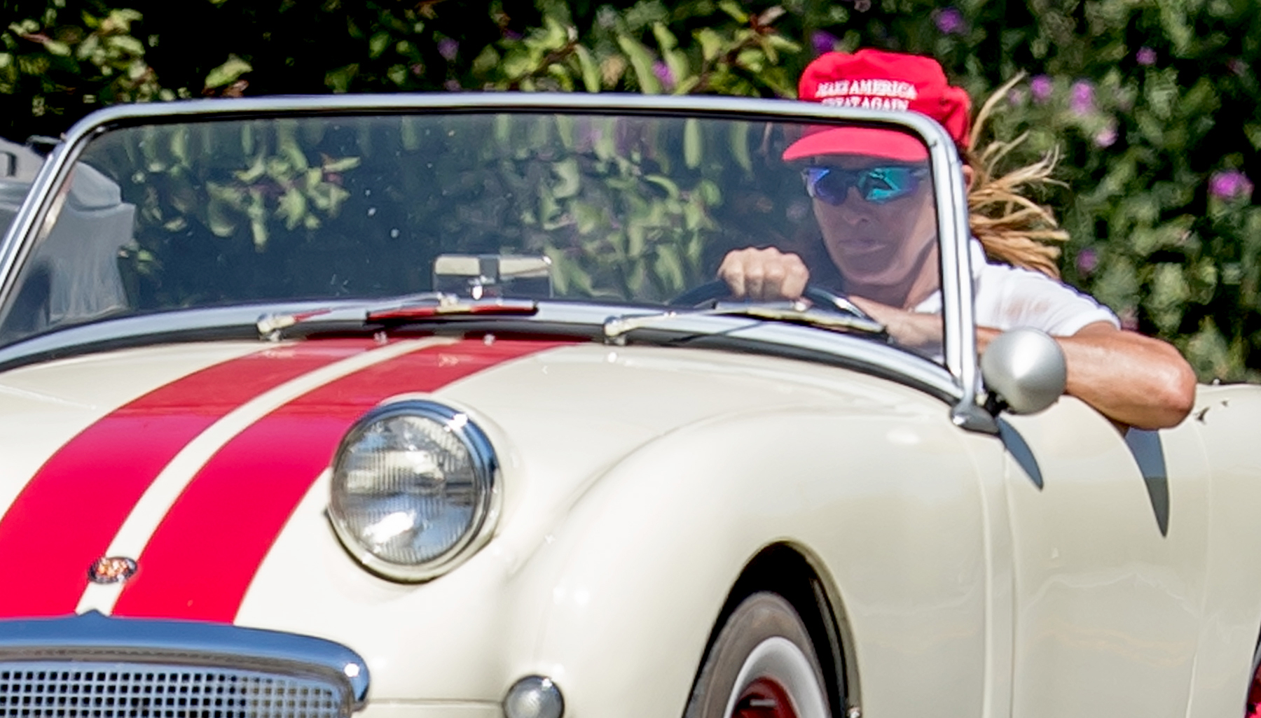Caitlyn Jenner wears a red 'Make America Great Again' while cruising her classic car in Malibu, CA, August 3, 2017.
