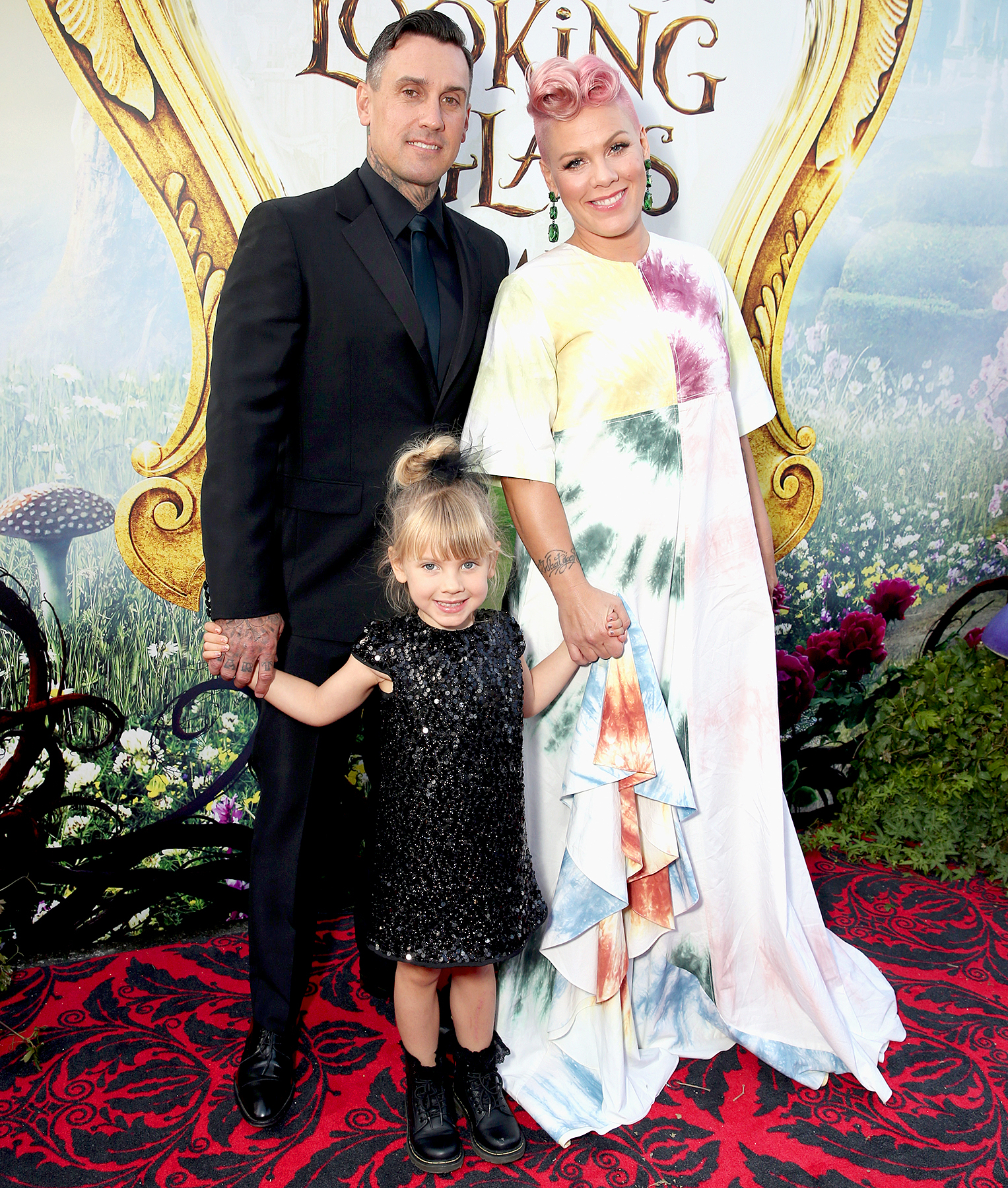 Carey Hart, Willow Sage Hart and singer-songwriter Pink attend the premiere of Disney's "Alice Through The Looking Glass" at the El Capitan Theatre on May 23, 2016.