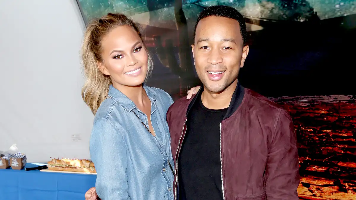 Chrissy Teigen and John Legend attend the DIRECTV Super Fan Tailgate at Pendergast Family Farm on February 1, 2015 in Glendale, Arizona.