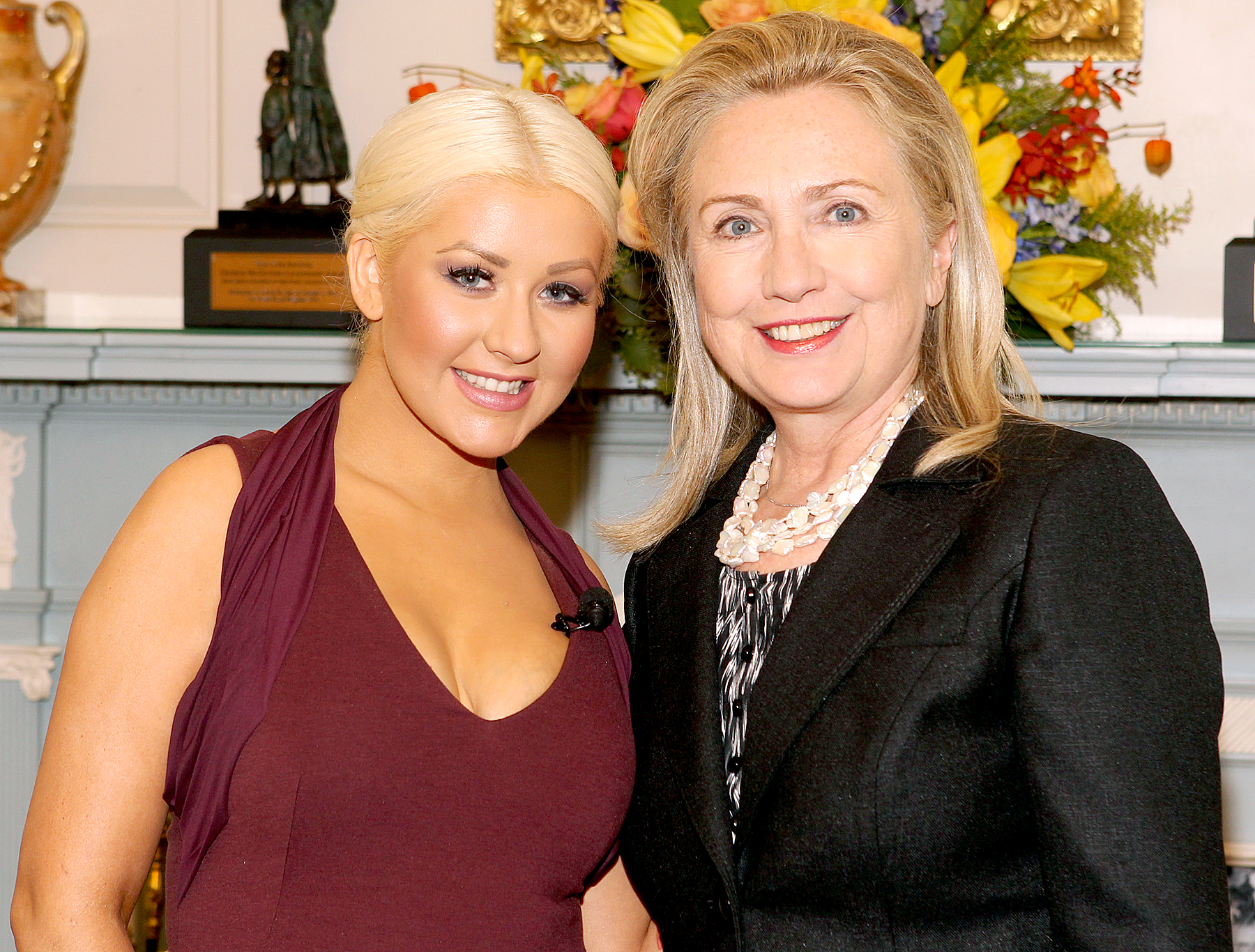 Christina Aguilera and Hillary Clinton pose for a photo at the George McGovern Leadership Award Ceremony where they were honored for their world hunger relief efforts by the World Food Progam at the U.S. State Department in Washington on Wednesday, Oct. 3, 2012.