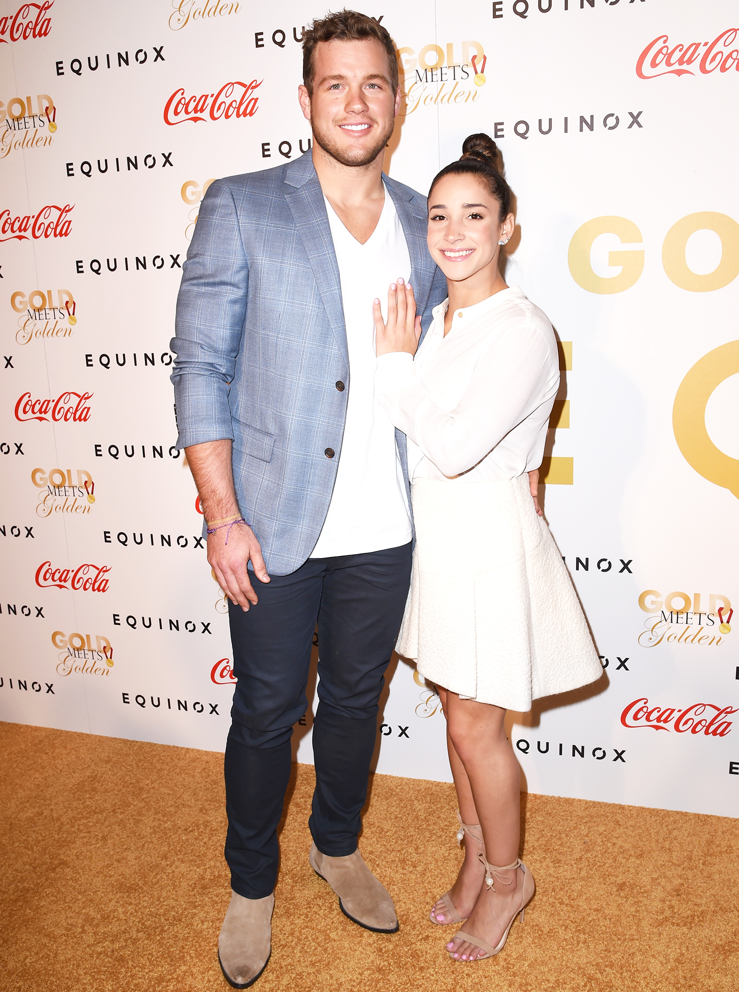 Aly Raisman and Colton Underwood attend Life is Good at GOLD MEETS GOLDEN Event at Equinox on January 7, 2017 in Los Angeles, California.