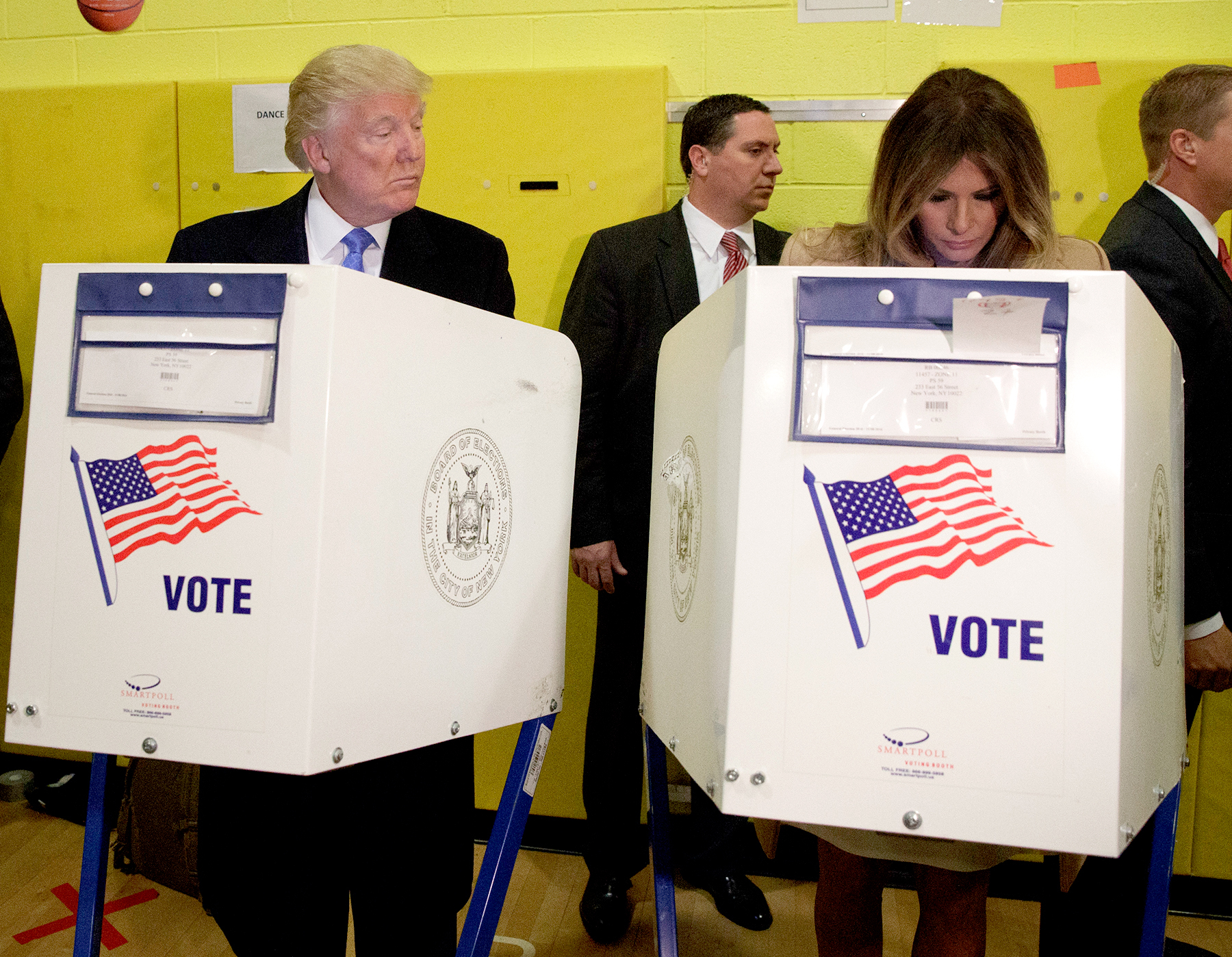 Republican presidential candidate Donald Trump looks at his wife Melania as they cast their votes at PS-59, Tuesday, Nov. 8, 2016, in New York.