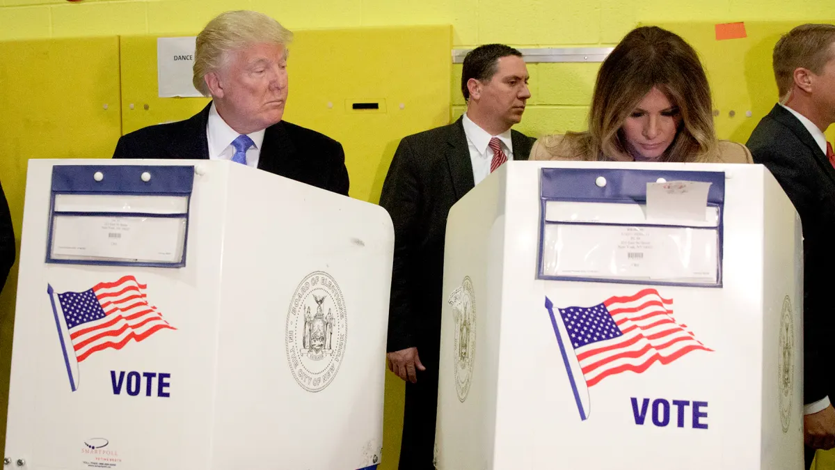 Republican presidential candidate Donald Trump looks at his wife Melania as they cast their votes at PS-59, Tuesday, Nov. 8, 2016, in New York.