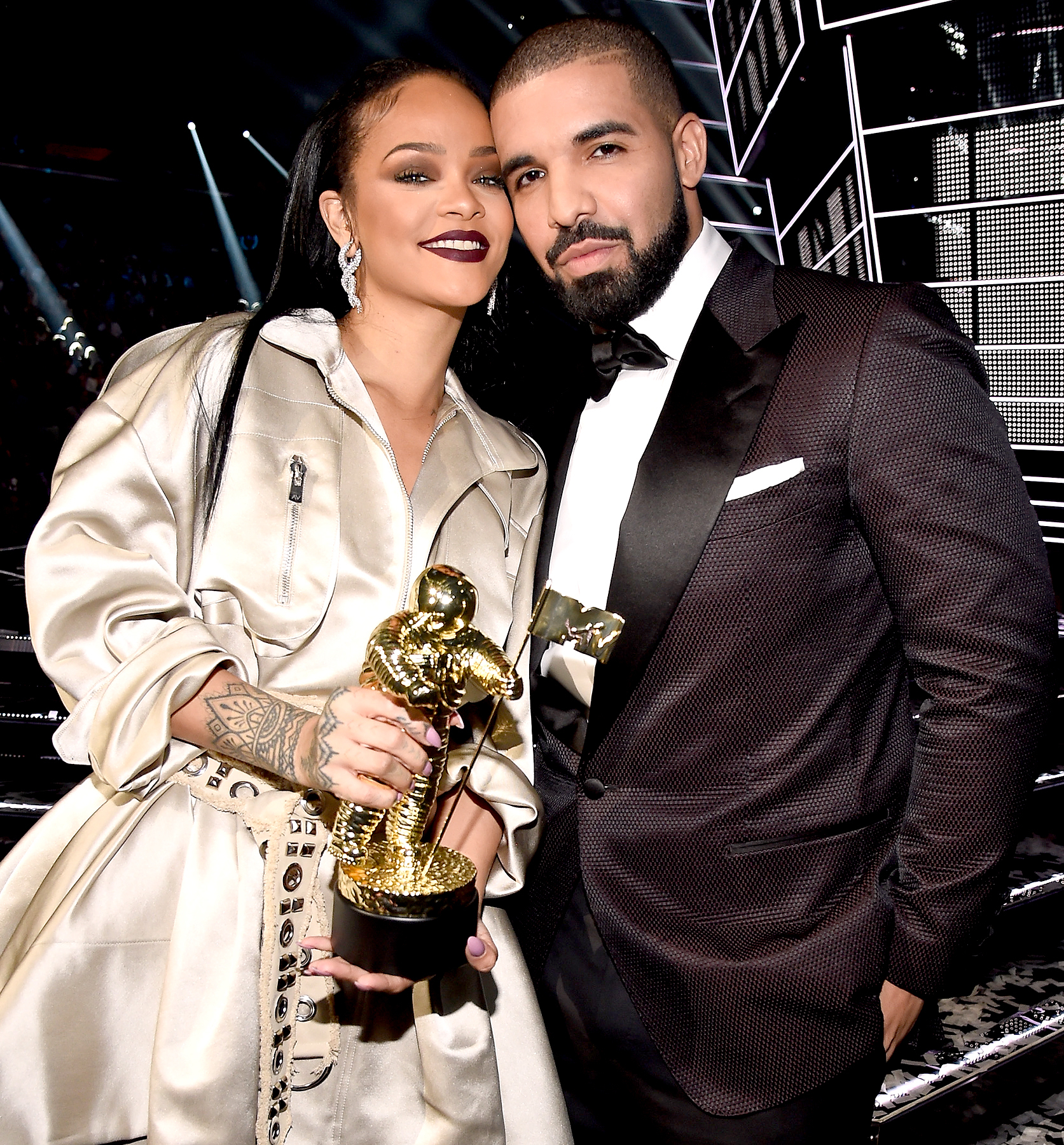 Rihanna and Drake pose onstage during the 2016 MTV Video Music Awards.