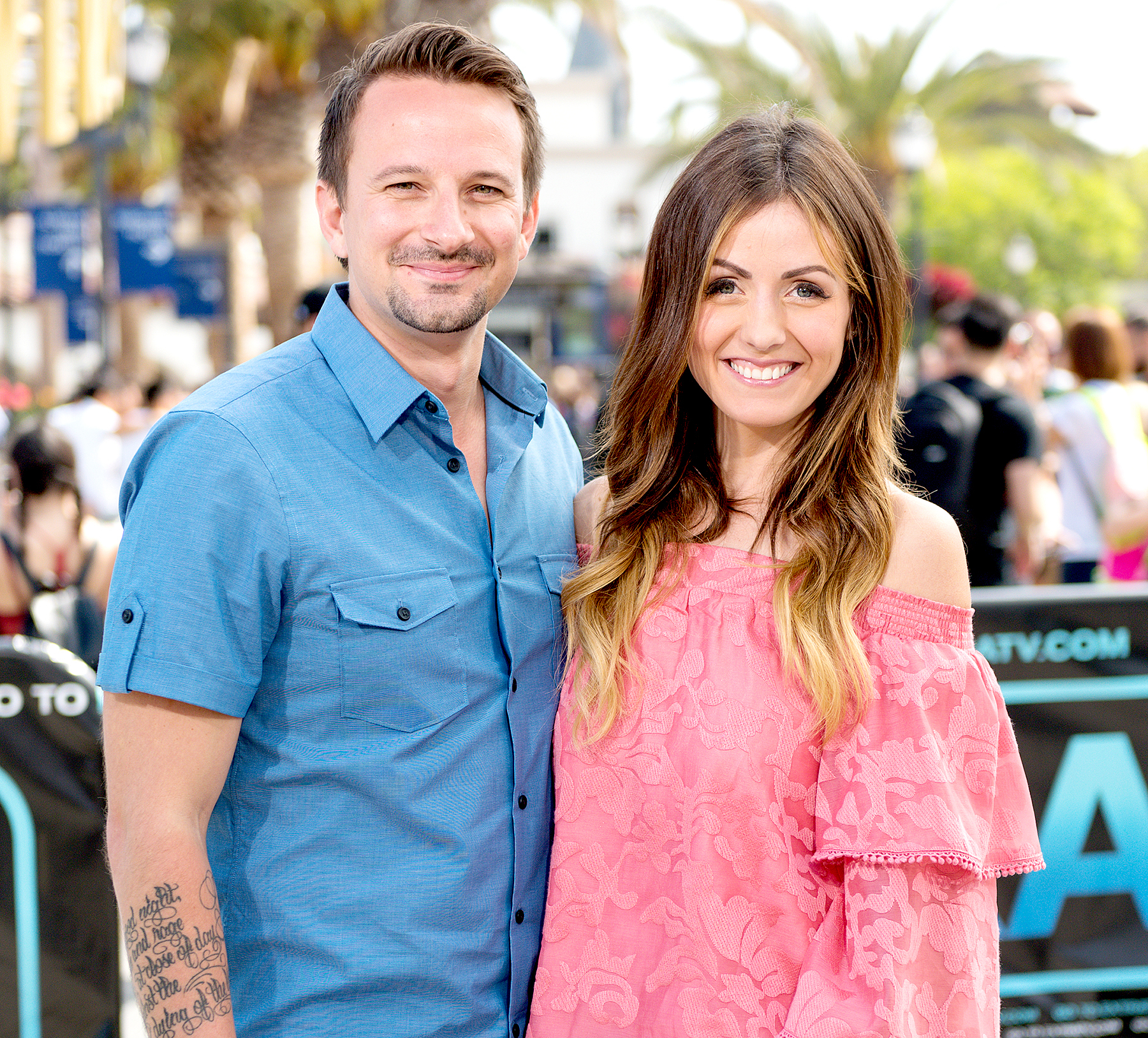 Evan Bass and Carly Waddell visit "Extra" at Universal Studios Hollywood on August 14, 2017 in Universal City, California.