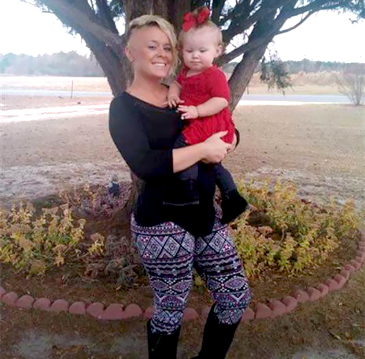 Heather Wilson and her toddler daughter, London,