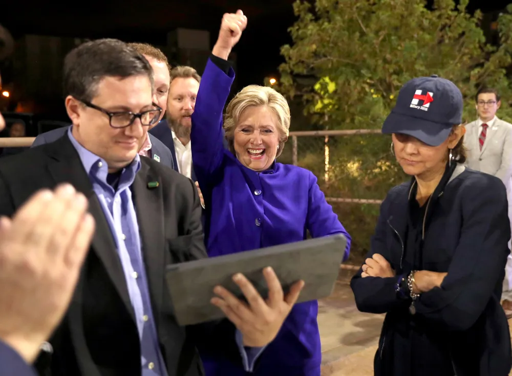 Democratic presidential candidate Hillary Clinton watches the World Series baseball game between the Chicago Cub and the Cleveland Indians after her final campaign rally of the day at Arizona State University in Tempe, Ariz., Wednesday, Nov. 2, 2016.