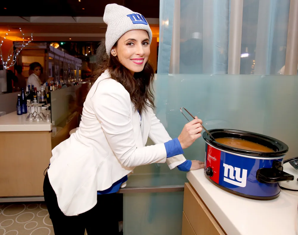 Jamie-Lynn Sigler stirs hot cider in an NFL Replica Luxury Handbaggating Crockpot, a perfect hostess gift for the holiday season.