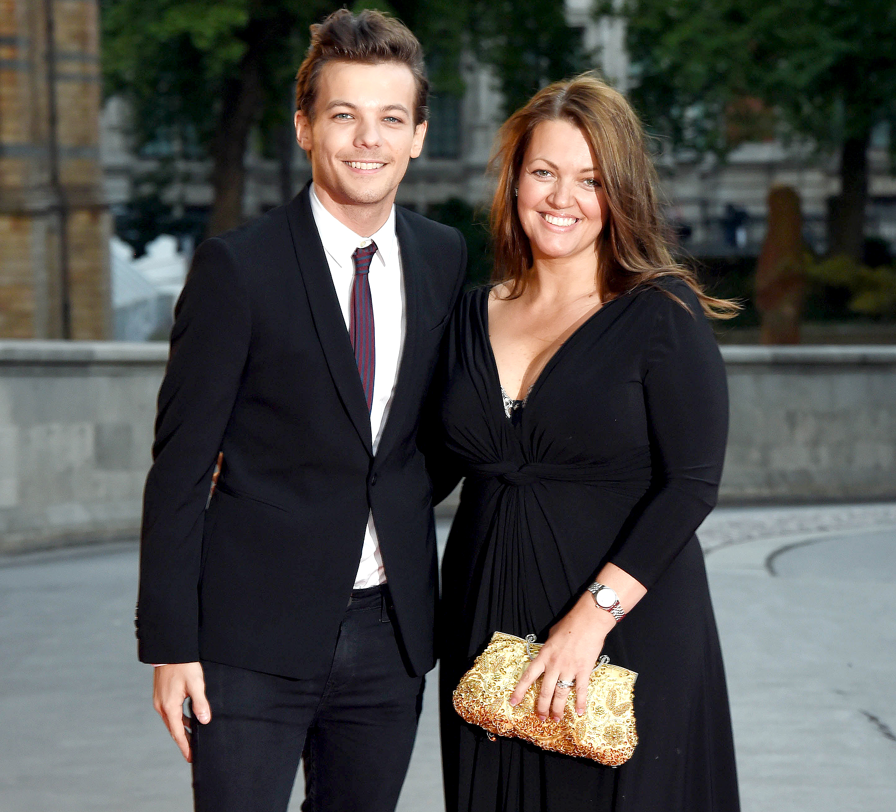 Louis Tomlinson and Johannah Poulston attend the Believe in Magic Cinderella Ball at Natural History Museum on August 10, 2015 in London, England.