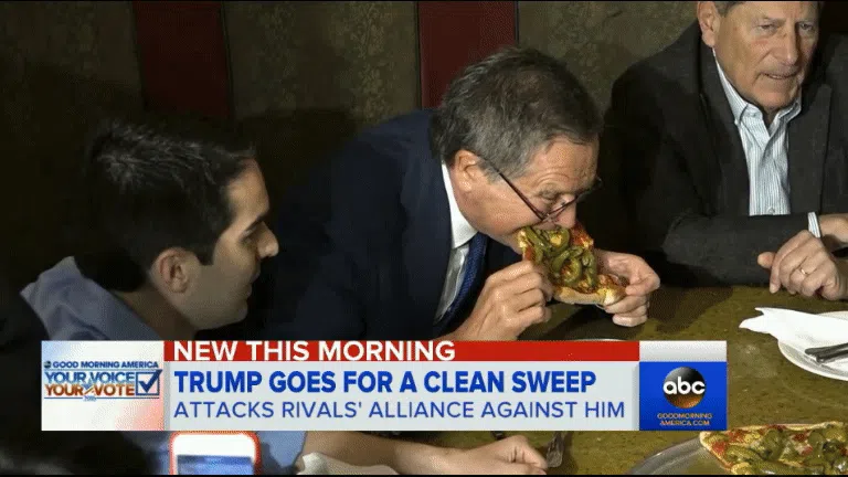 John Kasich eating pizza