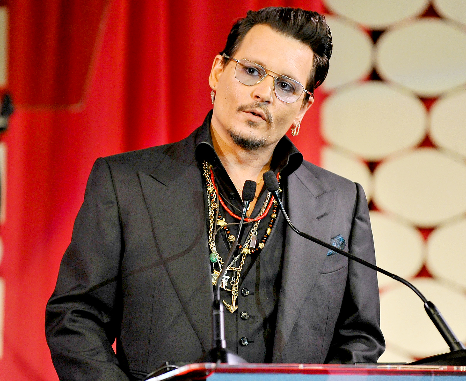 Johnny Depp on stage at the Make-Up Artists and Hair Stylists Guild Awards at Paramount Studios on February 20, 2016 in Hollywood, California.