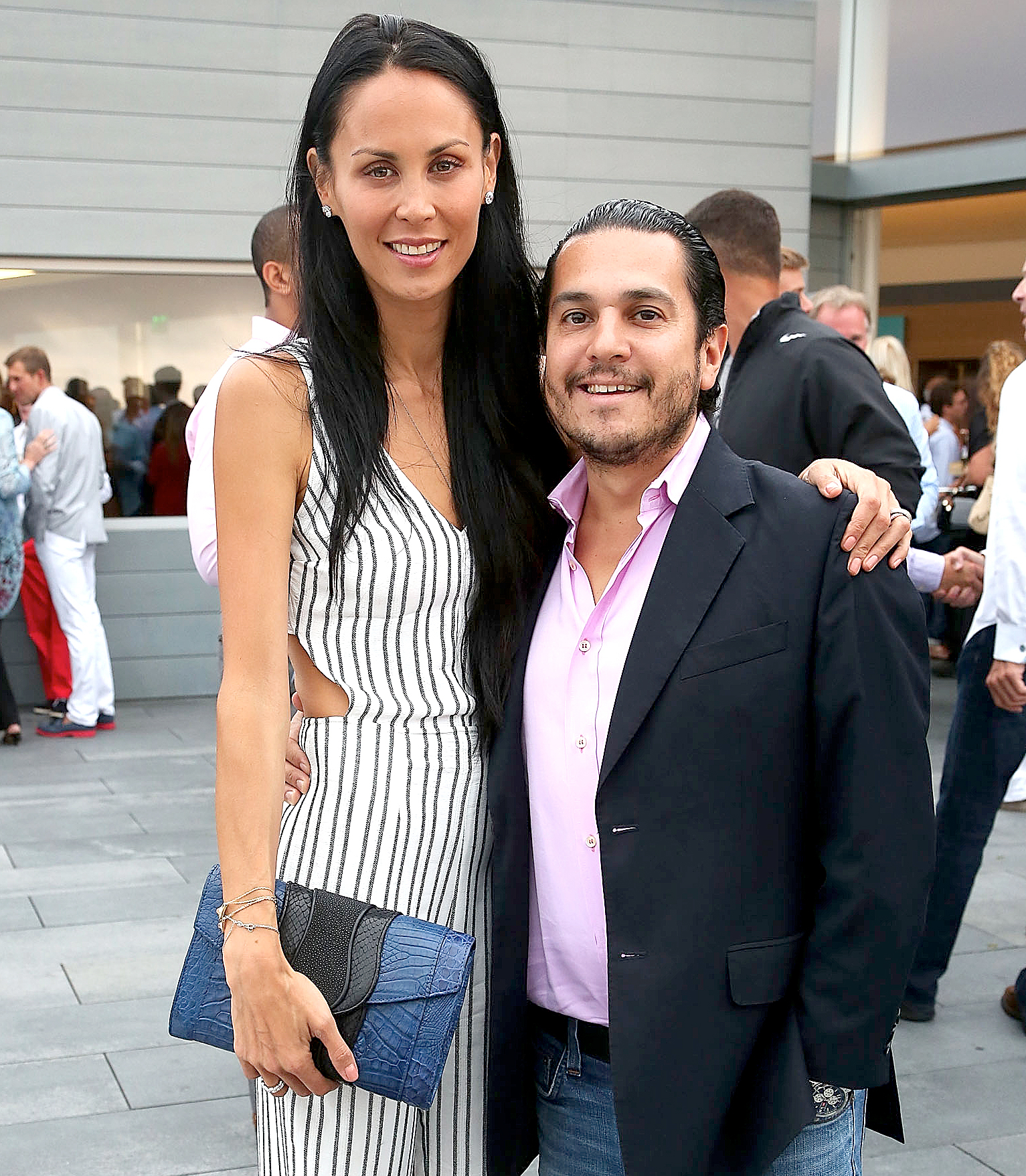 Julianne and Michael Wainstein attend the USTA Serves 2nd annual Pro-Am reception , sponsored by Sothebys, and BMW at The Bridge Golf Club on August 22, 2013 in Sag Harbor, New York.