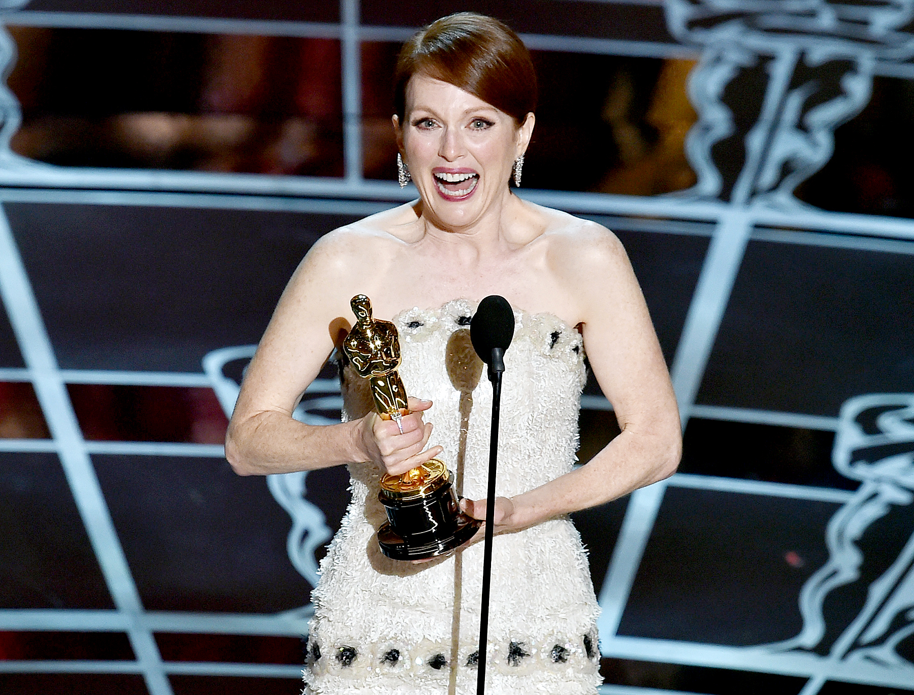 Julianne Moore accepts the Best Actress in a Leading Role award for 'Still Alice' on stage during the 87th annual Academy Awards.