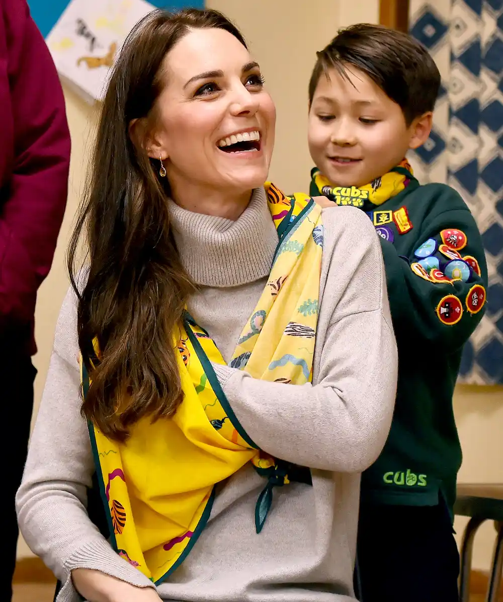 A cub scout uses a neckerchief to show Britain's Catherine, Duchess of Cambridge, how to support a broken arm, during a Cub Scout Pack meeting with cubs from the Kings Lynn District, in Kings Lynn, eastern England, on December 14, 2016, to celebrate 100 years of Cubs. The Duchess attended a special Cub Scout Pack meeting with Cubs from the Kings Lynn District to celebrate 100 years of Cubs. Cub Scouting was co-founded by Robert Baden-Powell and Vera Barclay on the 16th December 1916.