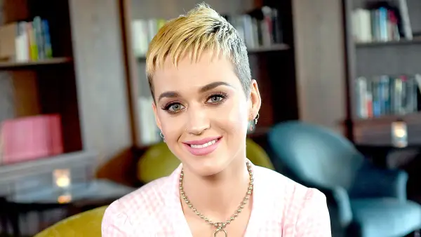 Katy Perry smiles for pictures during an interview in Berlin, Germany.