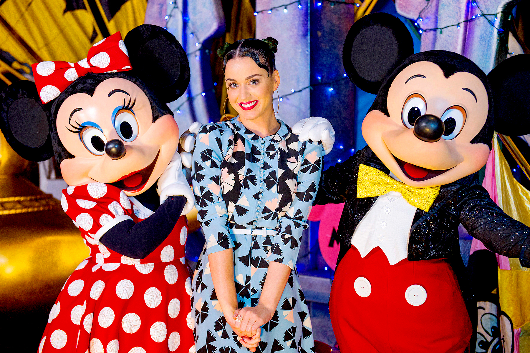Katy Perry poses with Minnie Mouse and Mickey Mouse at Disney's Hollywood Studios at Walt Disney World Resort on July 4, 2014 in Lake Buena Vista, Florida.