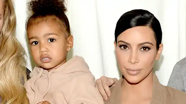North West and Kim Kardashian West attend Kanye West Yeezy Season 2 during New York Fashion Week at Skylight Modern on September 16, 2015 in New York City.
