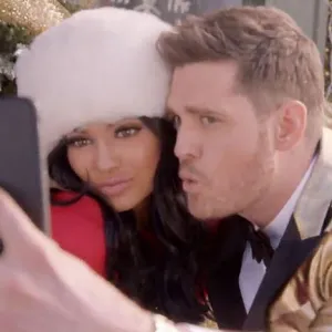 Kylie Jenner cozies up with Michael Buble