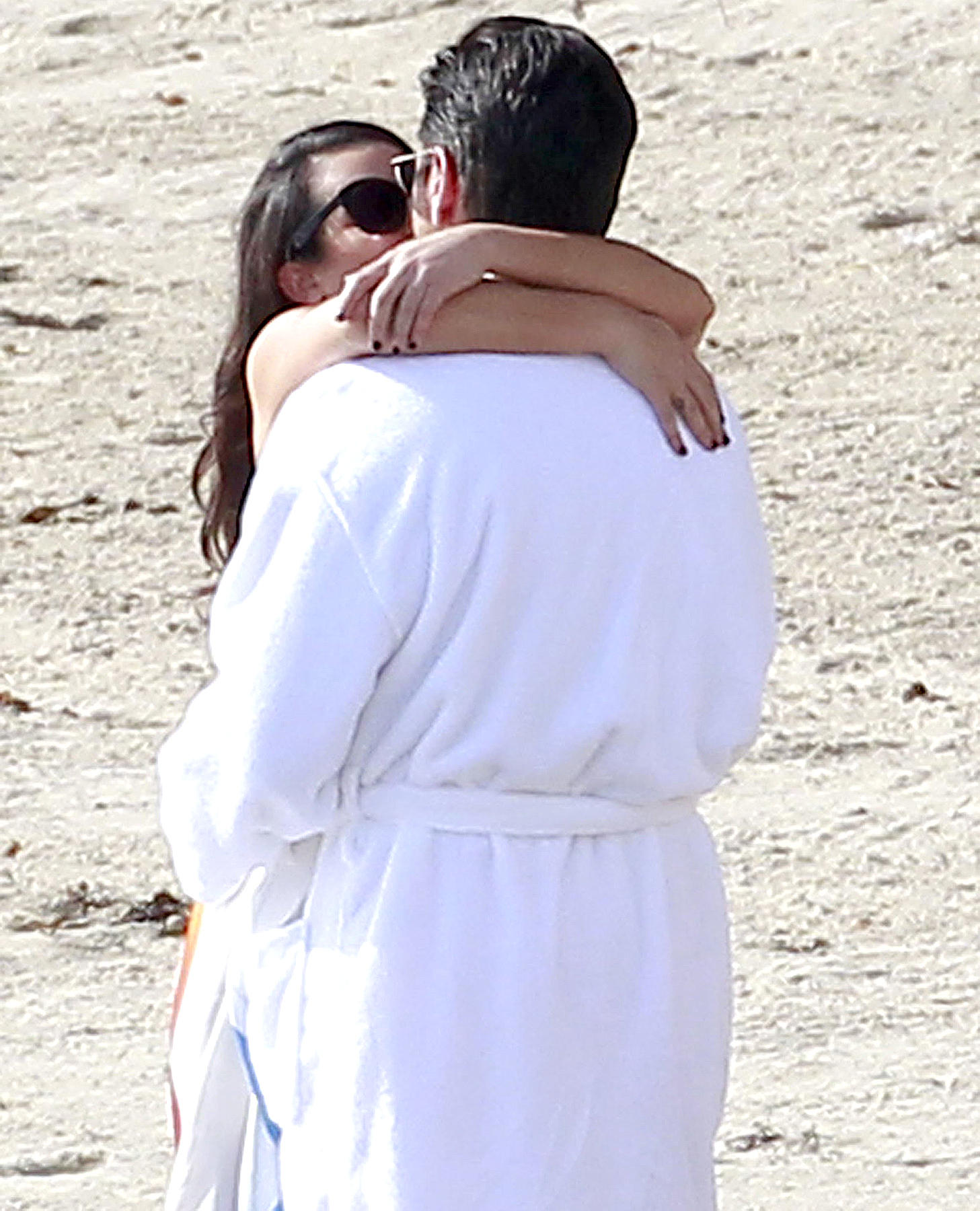 Lea Michele and John Stamos share a saucy seaside kiss whilst filming the season 2 finale of Scream Queens in Malibu.