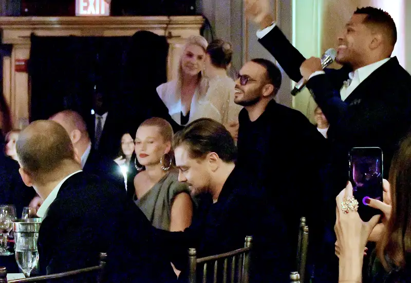 Maxwell (R) performs in front of Leonardo DiCaprio and Toni Garnn at the Unitas Third Annual Gala Against Human Trafficking at Capitale in New York City on September 12, 2017.
