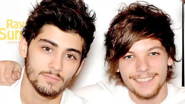 Zayn Malik and Louis Tomlinson pose for photographs at Wembley Arena as they made the wishes of 60 seriously ill children come true and met the children prior to performing at Wembley Stadium on June 8, 2014 in London, United Kingdom. Stuart C. Wilson/Getty Images for Rays of Sunshine